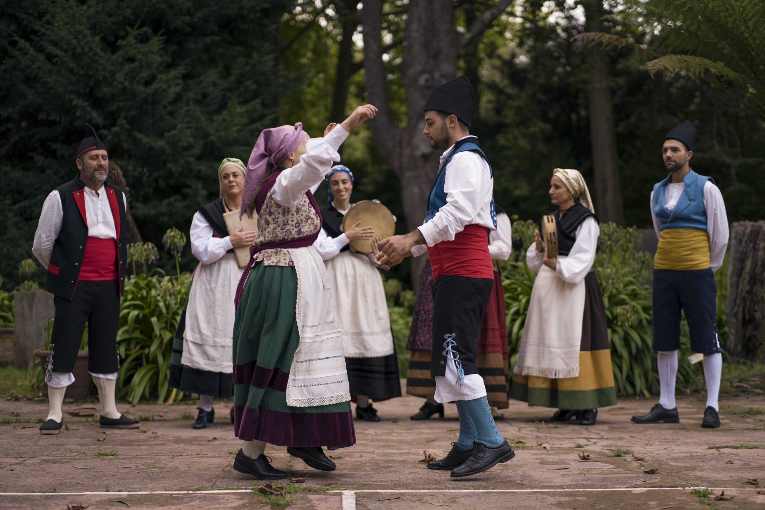 Polish Folk Dancers in Traditional Regional Costumes Performing a Cultural Dance Outdoors